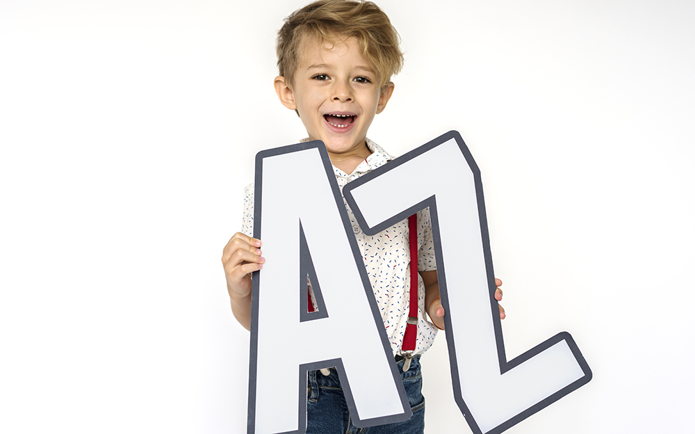 Little boy holding A-Z